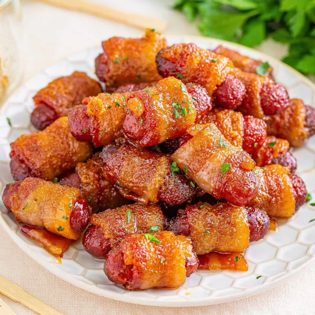 Delicious brown sugar bacon-wrapped smokies on a serving platter.