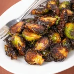 Crispy air fryer Brussels sprouts garnished and ready to serve