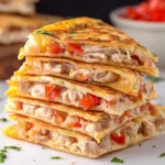 Golden brown Crispy Chicken Quesadillas filled with melted cheese and chicken.
