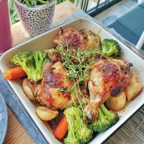 Sheet Pan Chicken with colorful vegetables ready to serve
