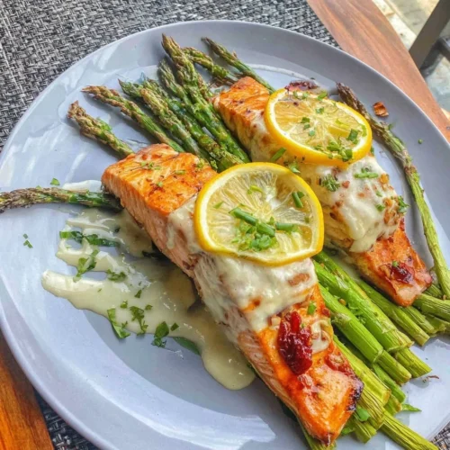 Sheet pan salmon with asparagus and lemon, a healthy dinner option.