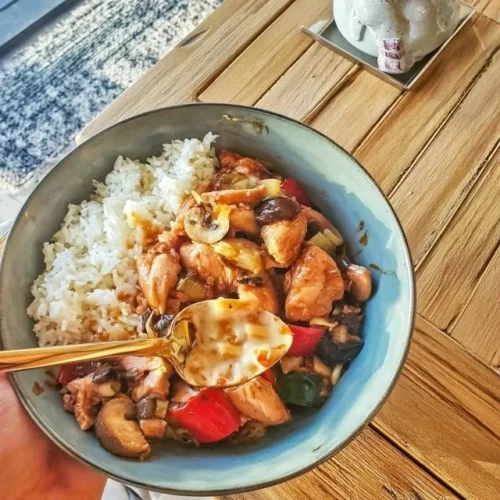 Delicious chicken teriyaki with colorful stir-fried vegetables and rice
