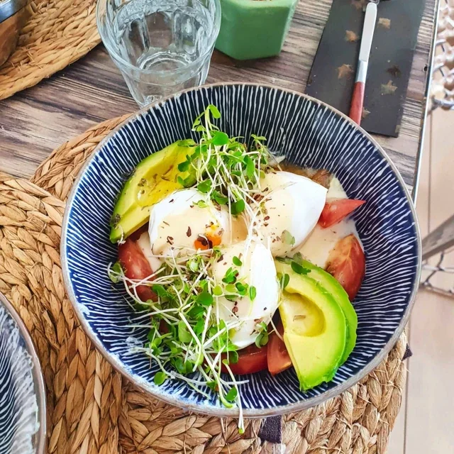 Healthy Energizing Brunch Bowl with Poached Eggs and Avocado