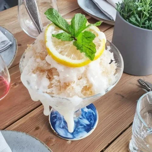 Refreshing Lemon Mint Granita served in a chilled glass with mint leaves