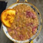 Great northern beans with smoked turkey neckbones and ho cakes π₯π₯ Pass me the hot sauce