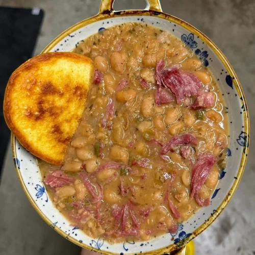 Great northern beans with smoked turkey neckbones and ho cakes 🔥🔥 Pass me the hot sauce