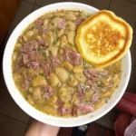 Lima beans and smoked ham hock with a hoecake