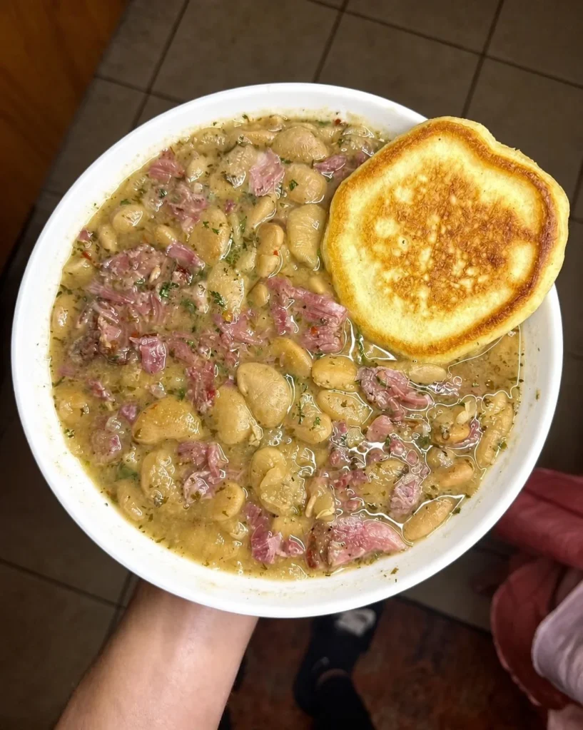 Lima beans and smoked ham hock with a hoecake