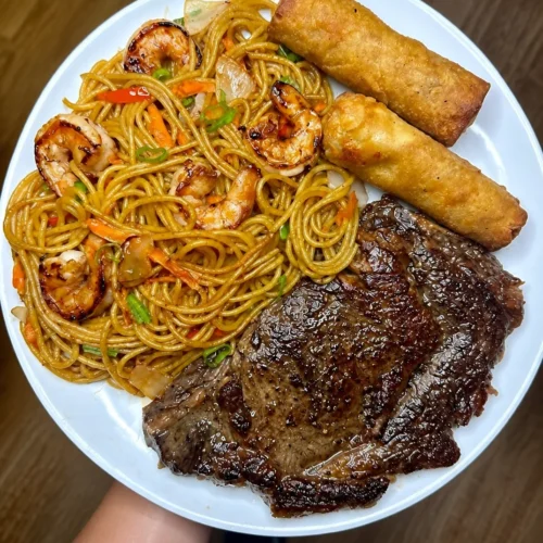 Plate of Ribeye with Shrimp Lo Mein featuring steak, shrimp, and noodles